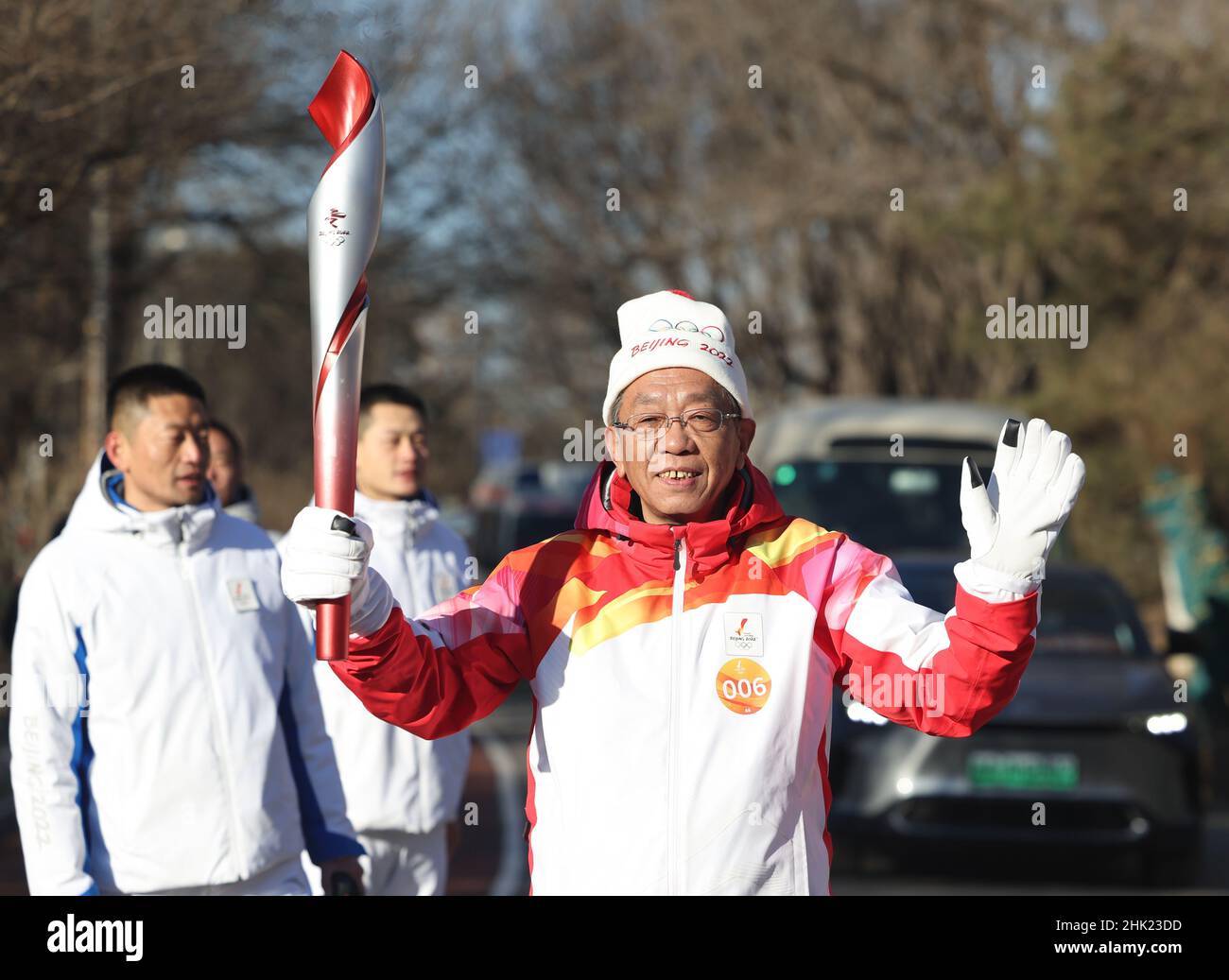 Beijing, China. 2nd Feb, 2022. Torch bearer Liu Zhijie runs with the ...