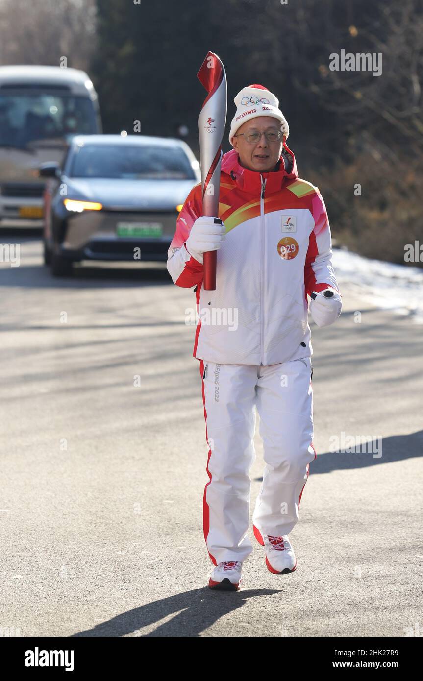 Beijing, China. 2nd Feb, 2022. Torch bearer Yang Zhong runs with the ...