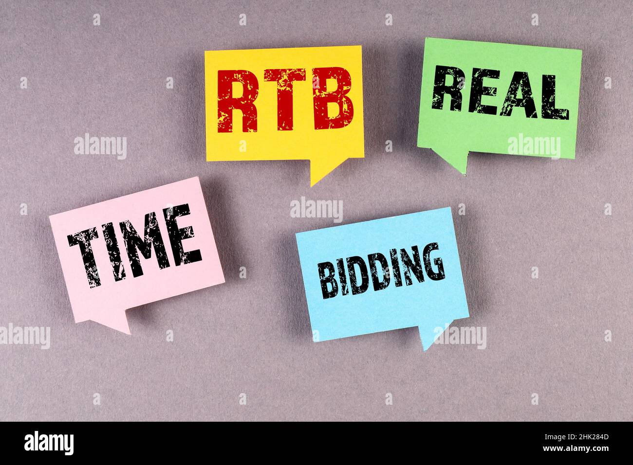 RTB Real Time Bidding. Speech bubbles on a gray background. Stock Photo