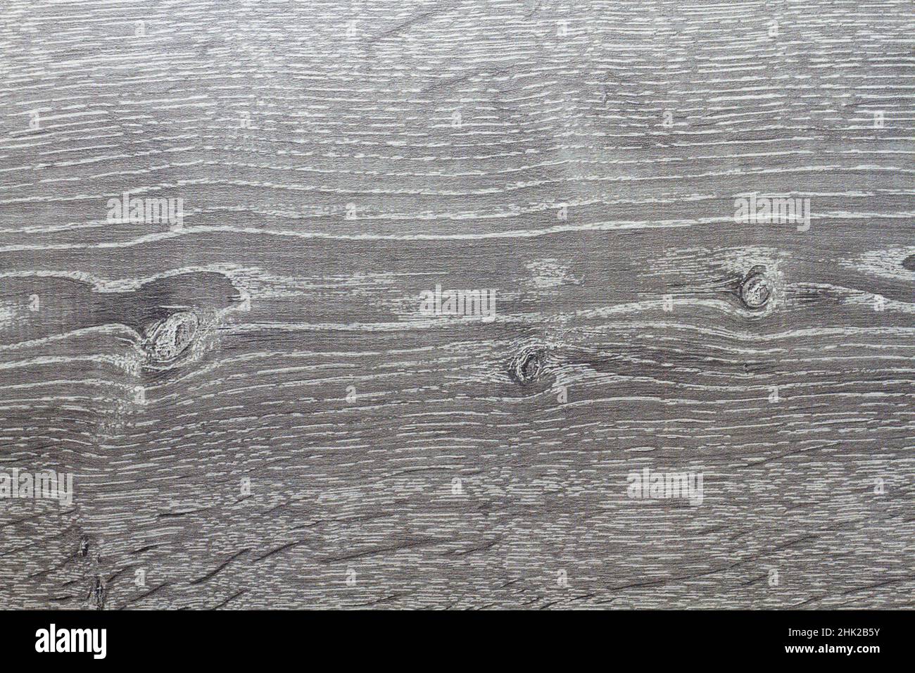 Wood texture. Wooden board close up. The cracks are deep. Laminate flooring. Tree rings in a cut