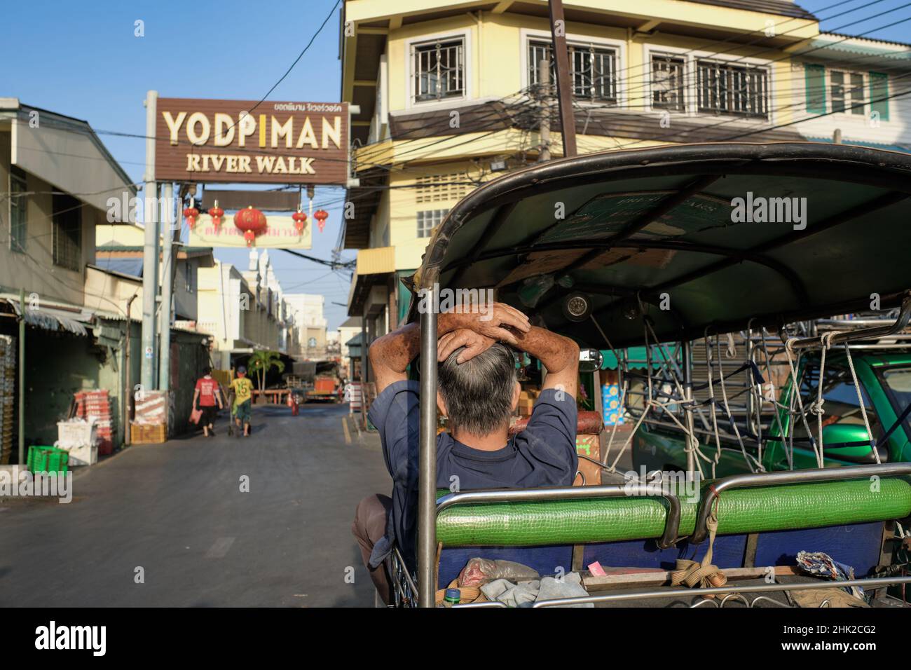 At Pak Klong Talat (market), Bangkok, Thailand, the driver of a tuk-tuk ...