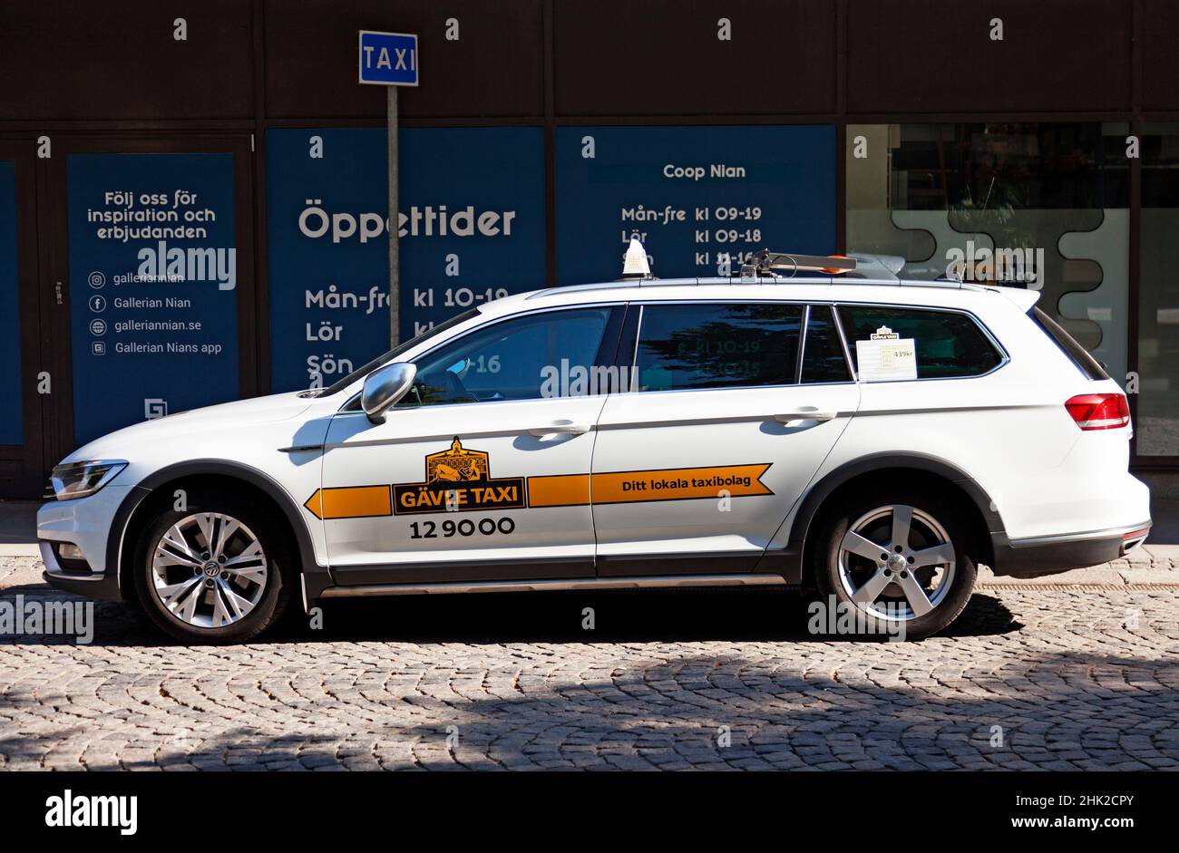 Gavle, Norrland Sweden - July 14, 2021: a white taxi waiting for customers to drive Stock Photo