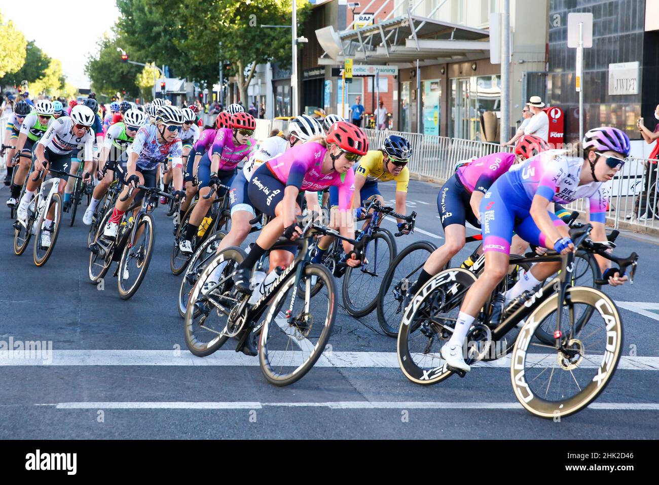 Riders in the Women's Night Rider's Criterium negotiation the streets of Adelaide for the 2022 Festival of Cycling in Australia Stock Photo