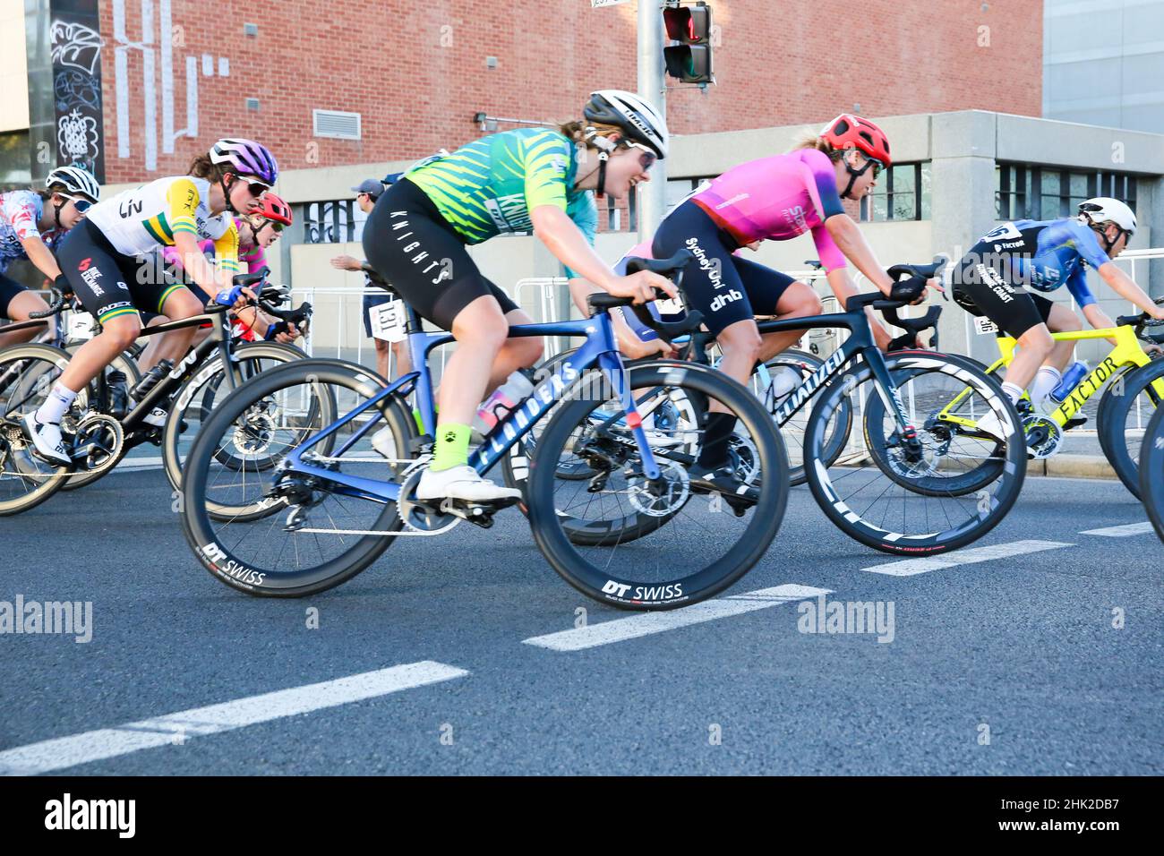 Riders in the Women's Night Rider's Criterium negotiation the streets of Adelaide for the 2022 Festival of Cycling in Australia Stock Photo