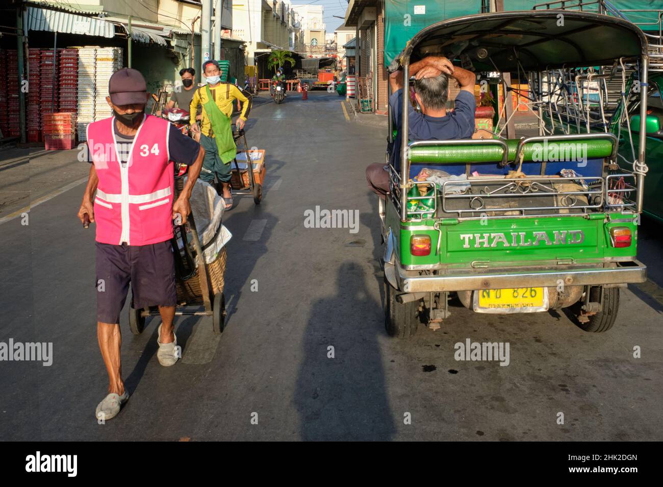 At Pak Klong Talat (market), Bangkok, Thailand, the driver of a tuk-tuk ...