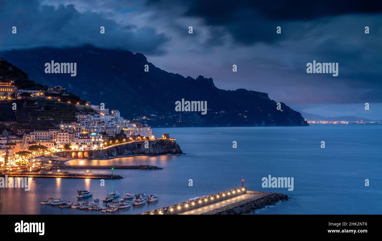 Europe, Italy, Campania. Sunset on town and Amalfi Coast Stock Photo ...