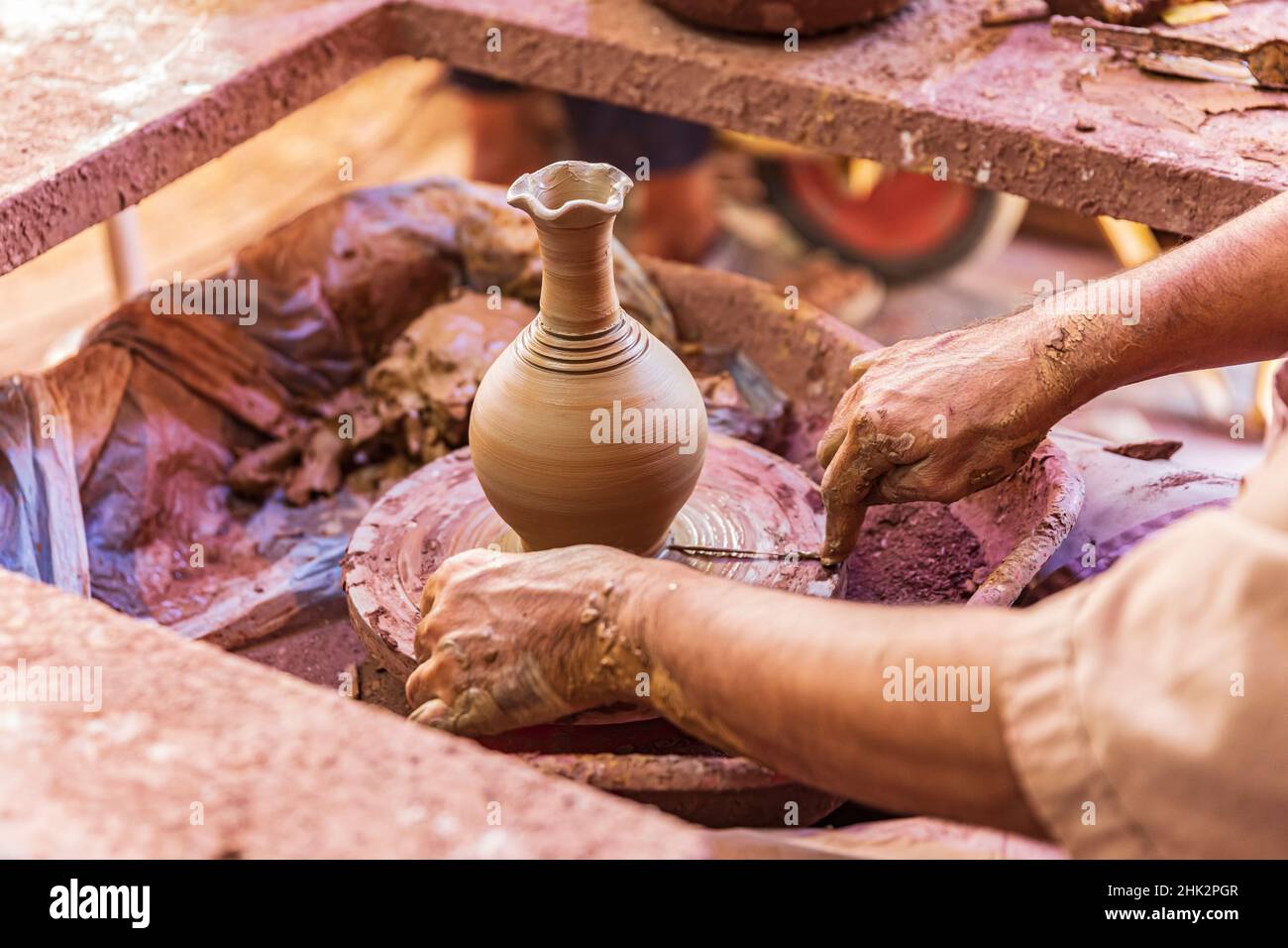 Middle East, Arabian Peninsula, Oman, Ad Dakhiliyah, Bahla. Man working