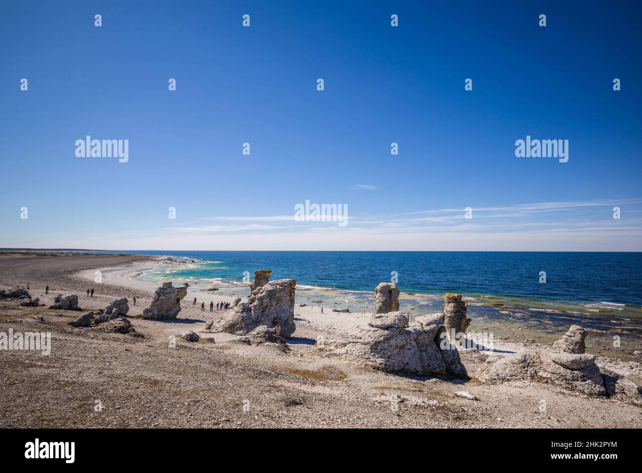 Sweden, Faro Island, Langhammars Area, Langhammar coastal limestone rauk rocks with visitors Stock Photo