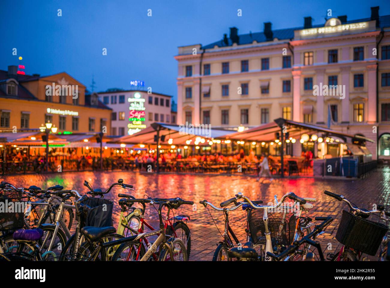 Sweden, Linkoping, cafes and bars on Stora target square, dusk Stock