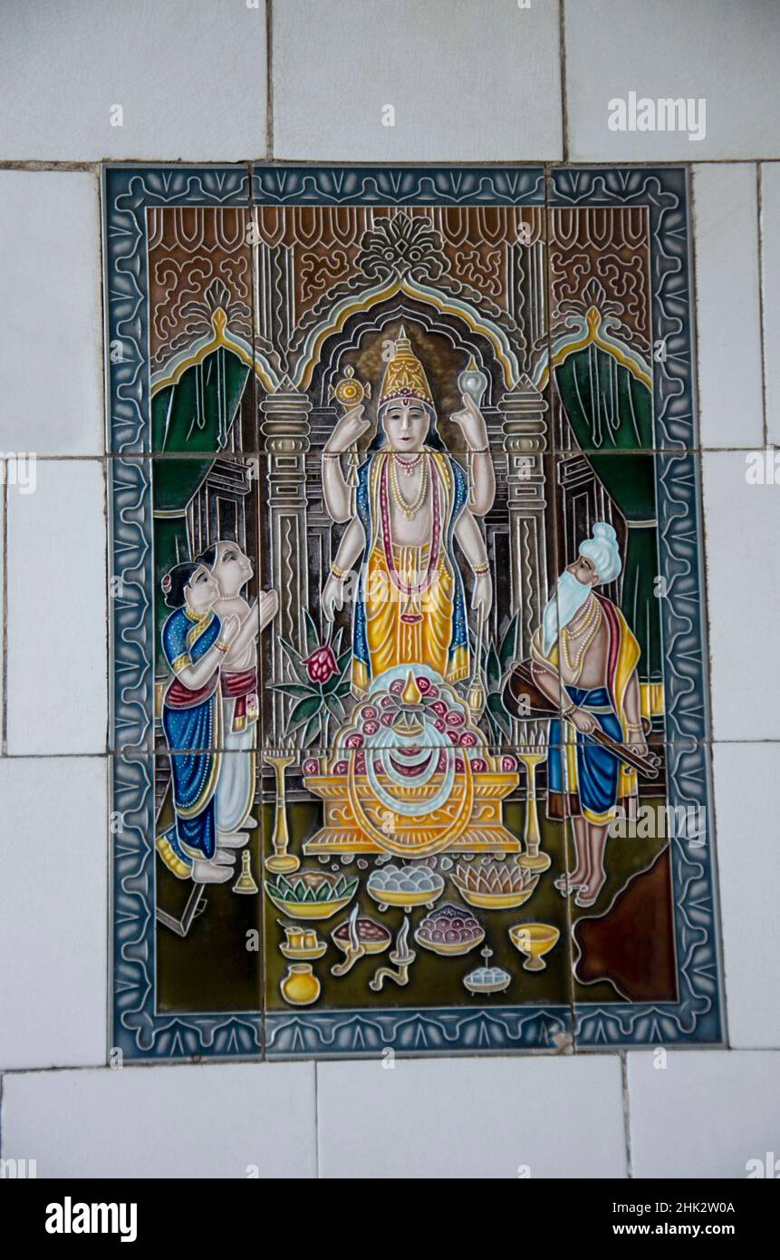 Decorated tiles of deities on the outer wall of Balaji Temple located in Dabhoi, Gujarat, India Stock Photo