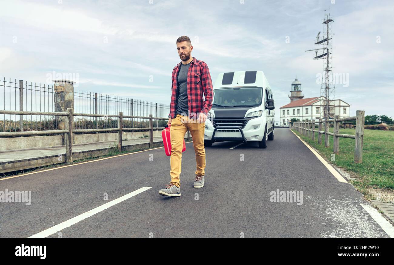 Man walking gas can hi-res stock photography and images - Alamy