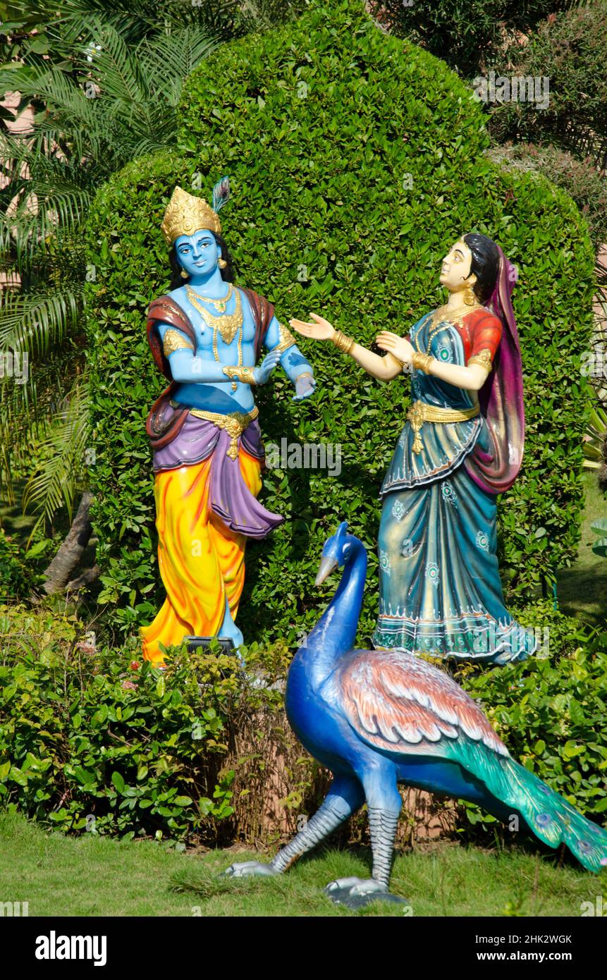 Radha and Krishna idols in different poses in garden of Nilkanthdham, Swaminarayan temple, Poicha, Gujarat, Stock Photo