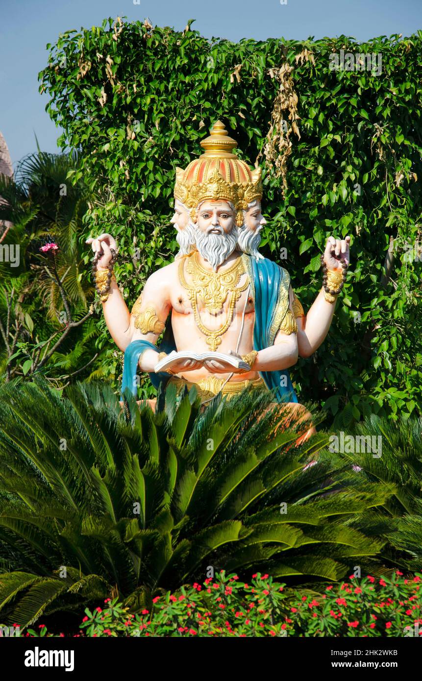Statue of Lord Brahma in gardens at Nilkanthdham, Swaminarayan temple complex, Poicha, Poicha, Gujarat, India Stock Photo