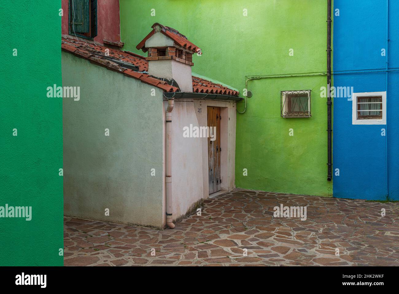Europe, Italy, Venice. Colorful house exteriors in Burano. Stock Photo