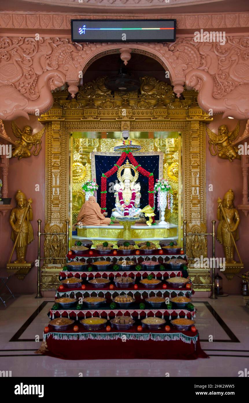 Lord Swaminarayan idol inside the temple at Swaminarayan temple, Nilkanthdham, Poicha, Gujarat, India Stock Photo