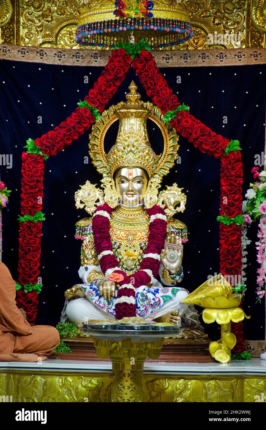 Lord Swaminarayan idol closeup inside the temple at Swaminarayan temple, Nilkanthdham, Poicha, Gujarat, India Stock Photo