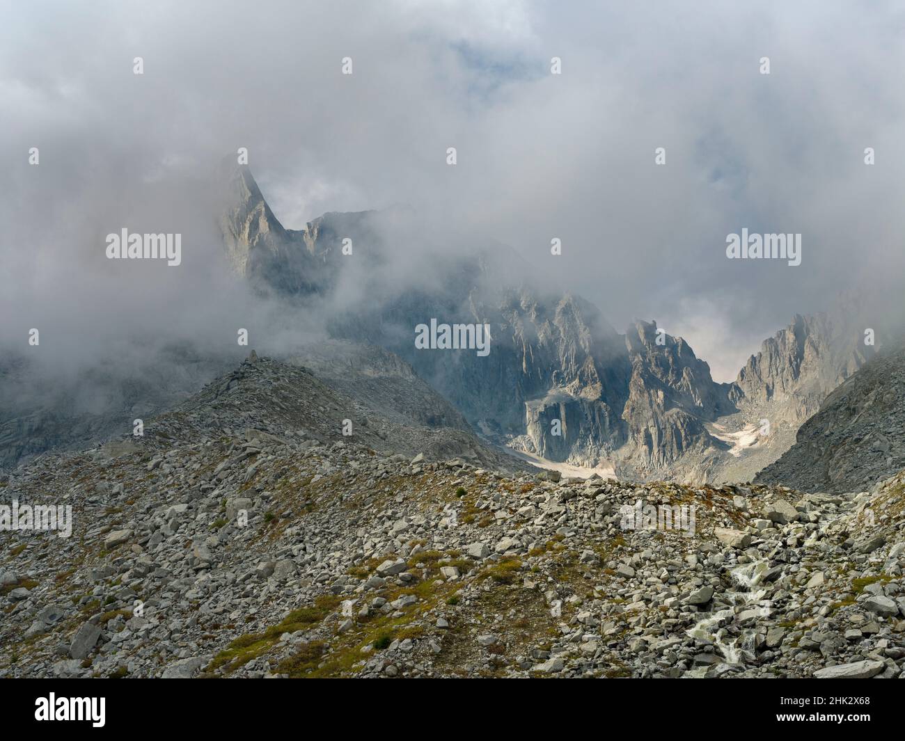 View towards Cima Presanella draped in clouds near Rifugio Segantini. Presanella mountain range, Parco Naturale Adamello, Brenta, Trentino, Italy, Val Stock Photo