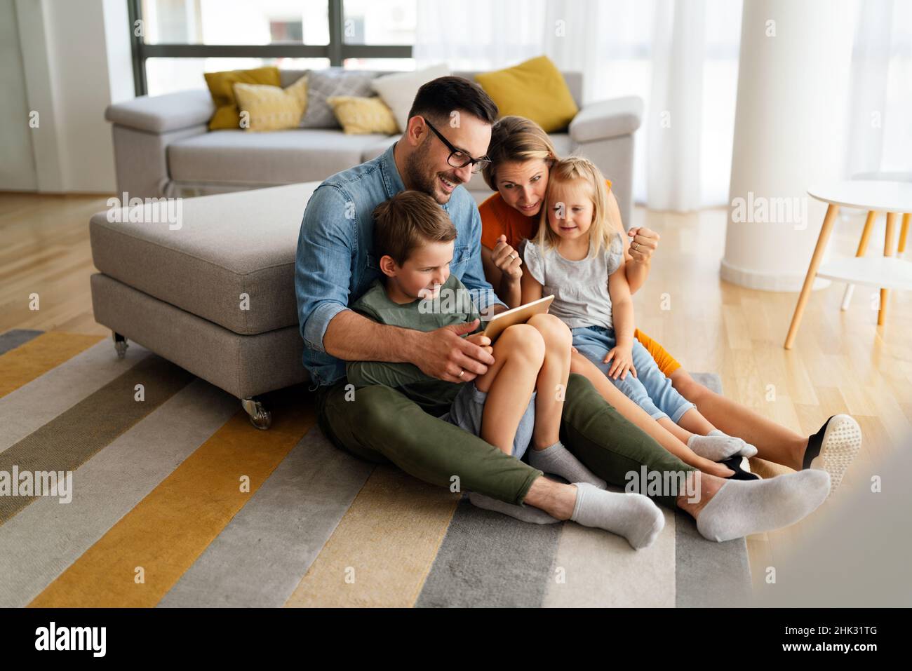 Device technology family online education concept. Happy family with ...