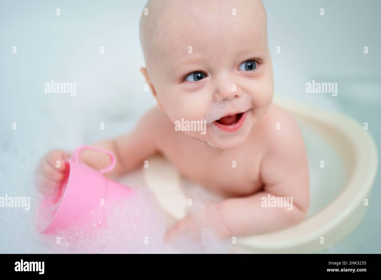baby bathes in the bathroom Stock Photo Alamy
