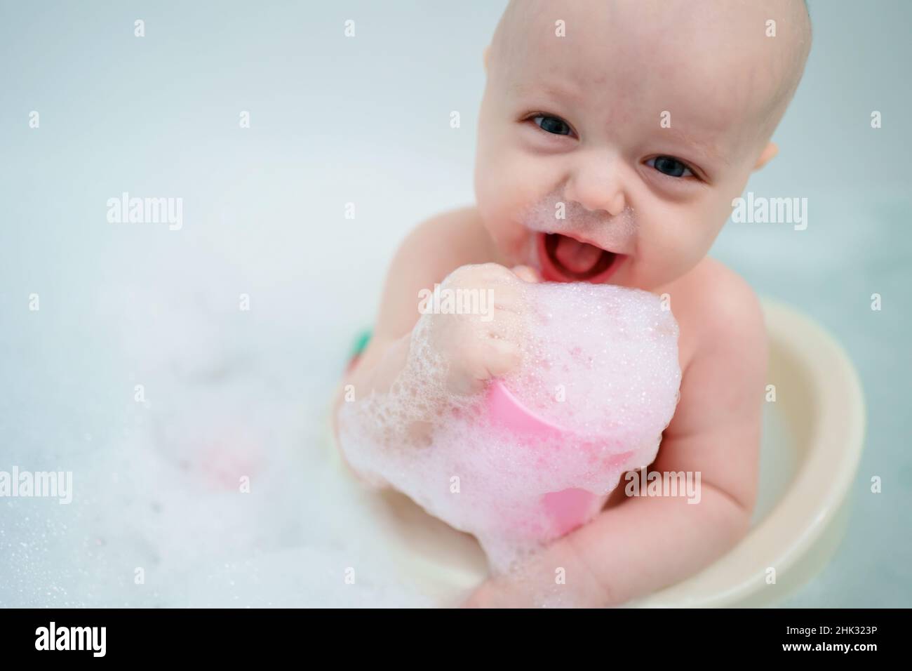 baby bathes in the bathroom Stock Photo Alamy