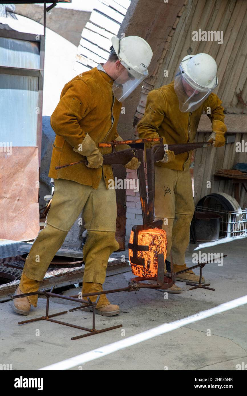 USA, Arizona, Scottsdale. Windbell casters with molten bronze casting. Stock Photo