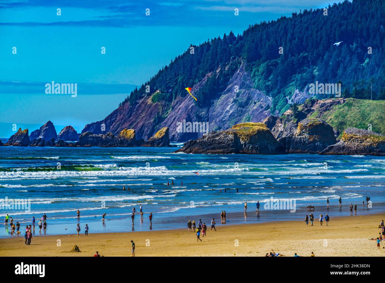 Colorful beach tourists, Canon Beach, Clatsop County, Oregon. Originally discovered by Clark of Lewis Clark in 1805 Stock Photo