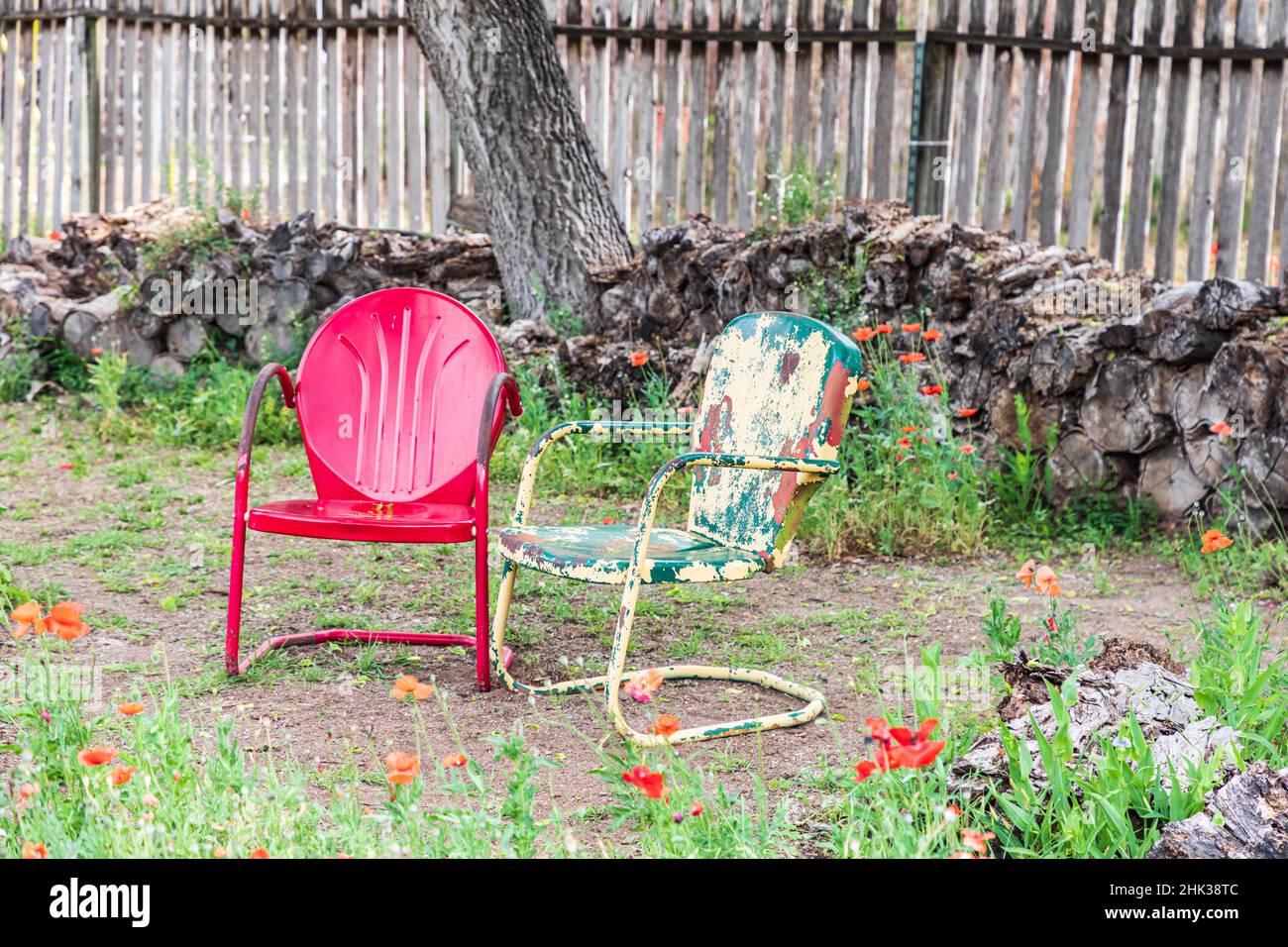 Castroville, Texas, USA. Metal chairs in a yard in the Texas Hill