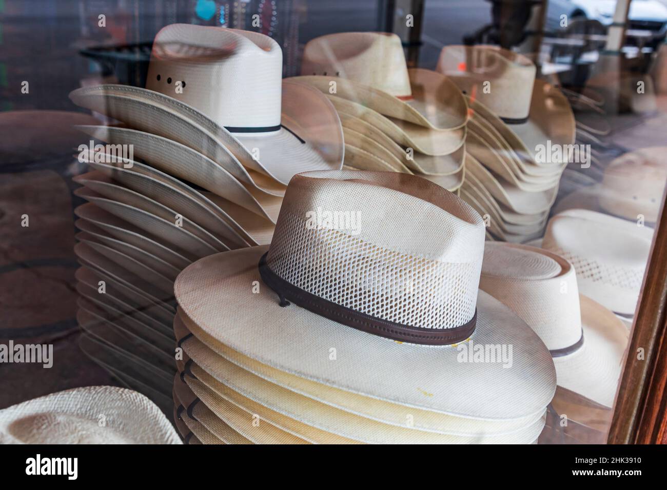 Fredericksburg, Texas, USA. Cowboy hats in a storefront window in the
