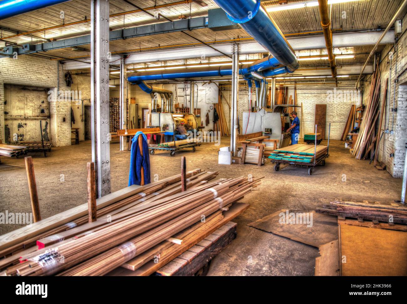 ‌interior of lumber mill processing machine to finish wood in Hdr Stock