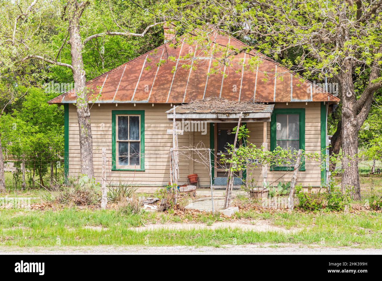 Sisterdale, Texas, USA. Small old house with a rusted metal roof in the