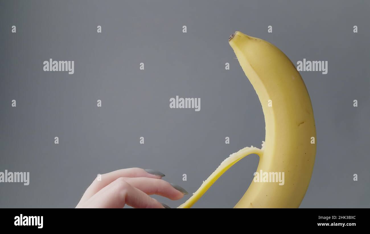 Peeling banana hand hi-res stock photography and images - Alamy