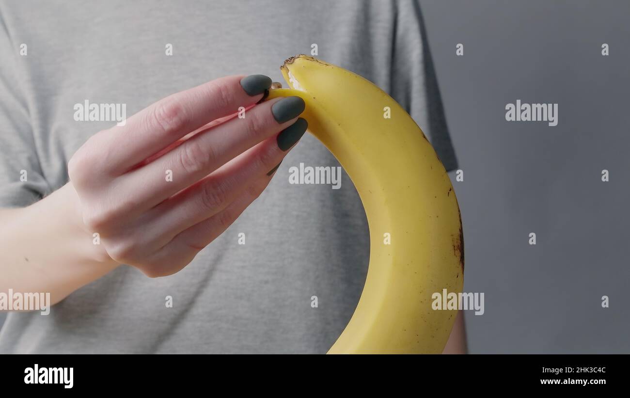 Peeling banana hand hi-res stock photography and images - Alamy