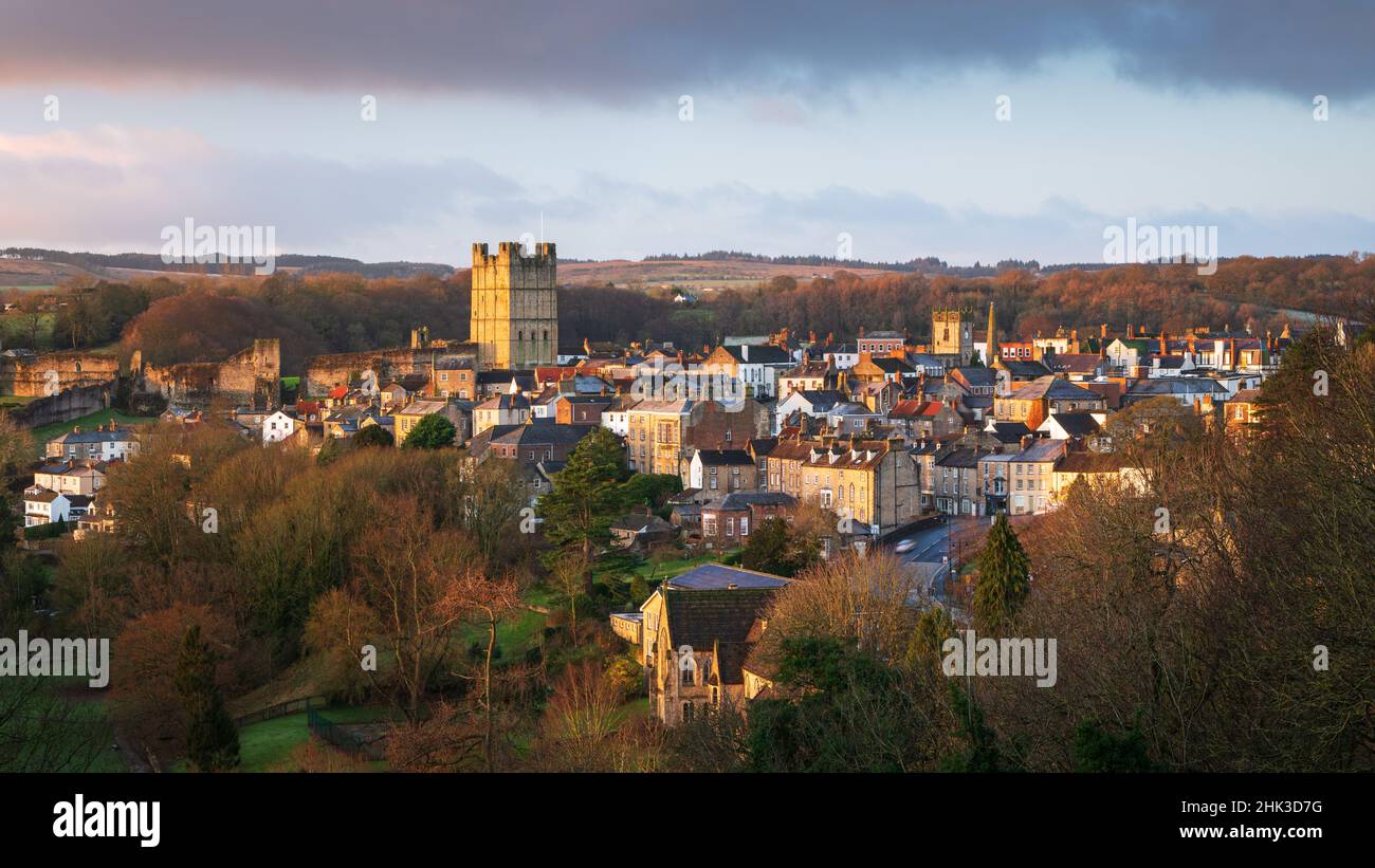Richmond Castle catches the first golden light of a new day during a chilly winter sunrise in North Yorkshire on the edge of the Dales. Stock Photo