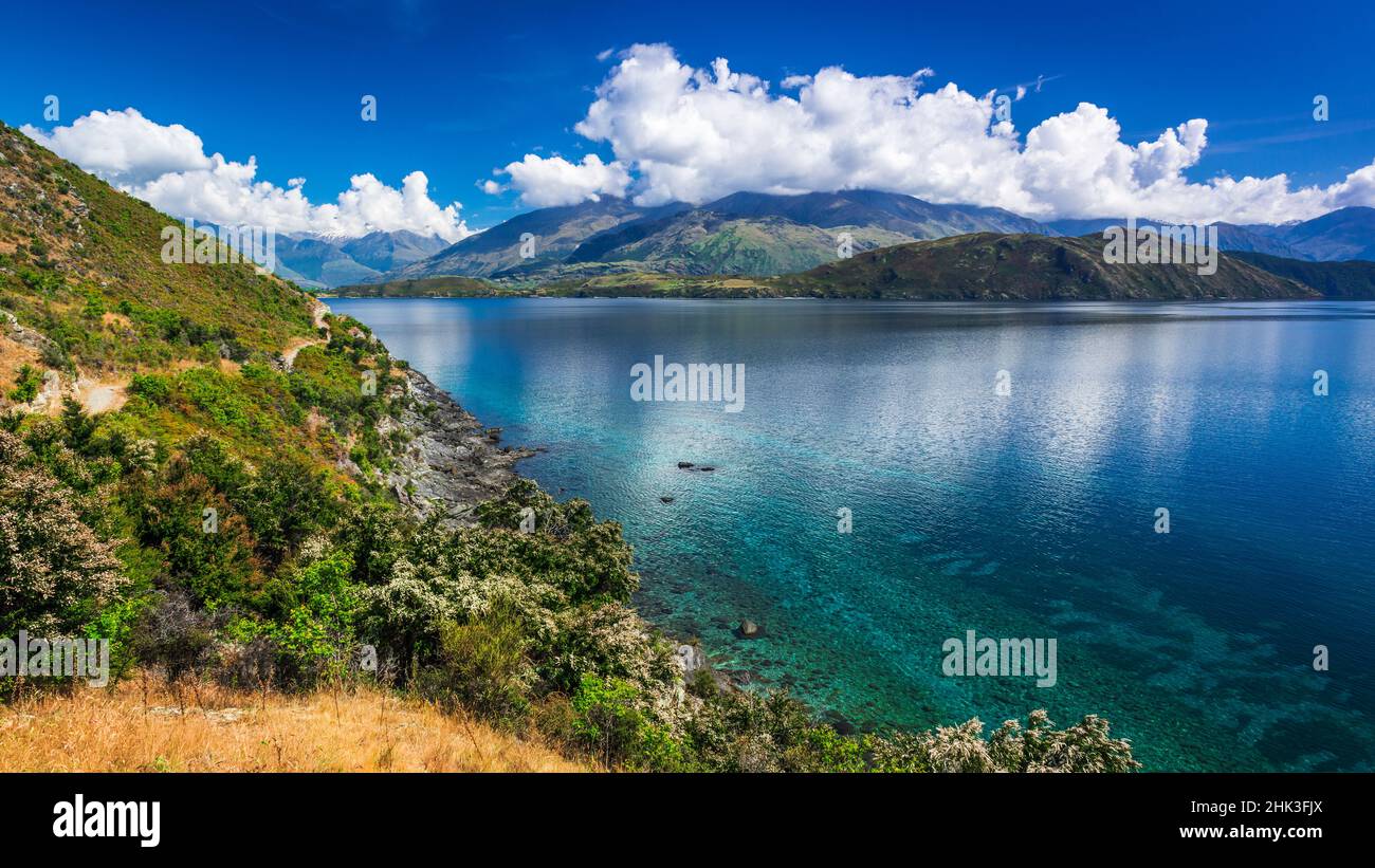 Cycling the shore of Lake Wanaka, Otago, South Island, New Zealand ...