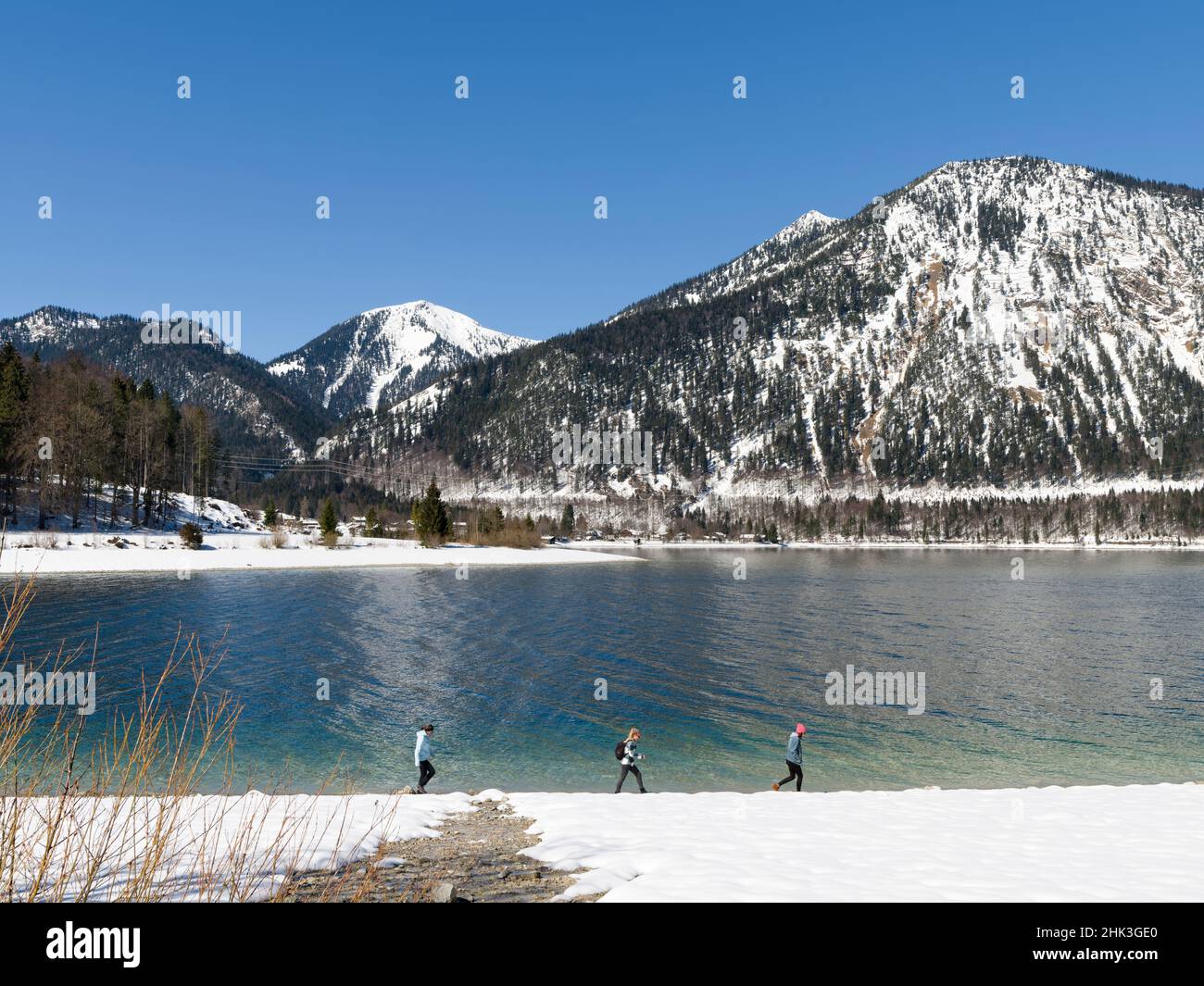 View towards village Walchensee, Mt. Herzogstand and Mt. Heimgarten. Lake Walchensee in the snowy Bavarian Alps. Germany, Bavaria. (Editorial Use Only Stock Photo