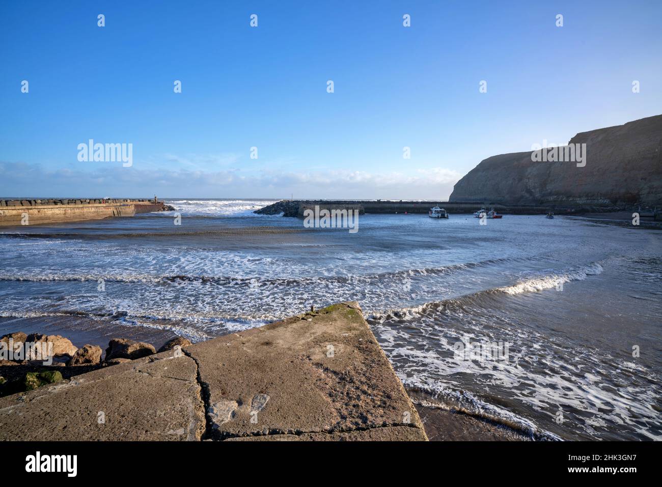 Staithes seaside town and sea defenses in North Yorkshire Stock Photo