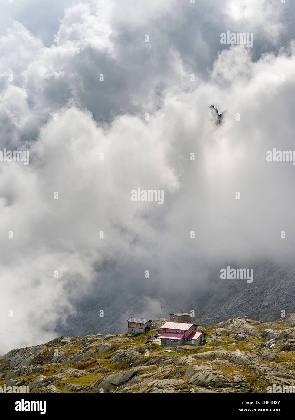Rifugio Segantini and dramatic clouds in the Presanella mountain range, Parco Naturale Adamello, Brenta, Trentino, Italy, Val Rendena. (Editorial Use Stock Photo