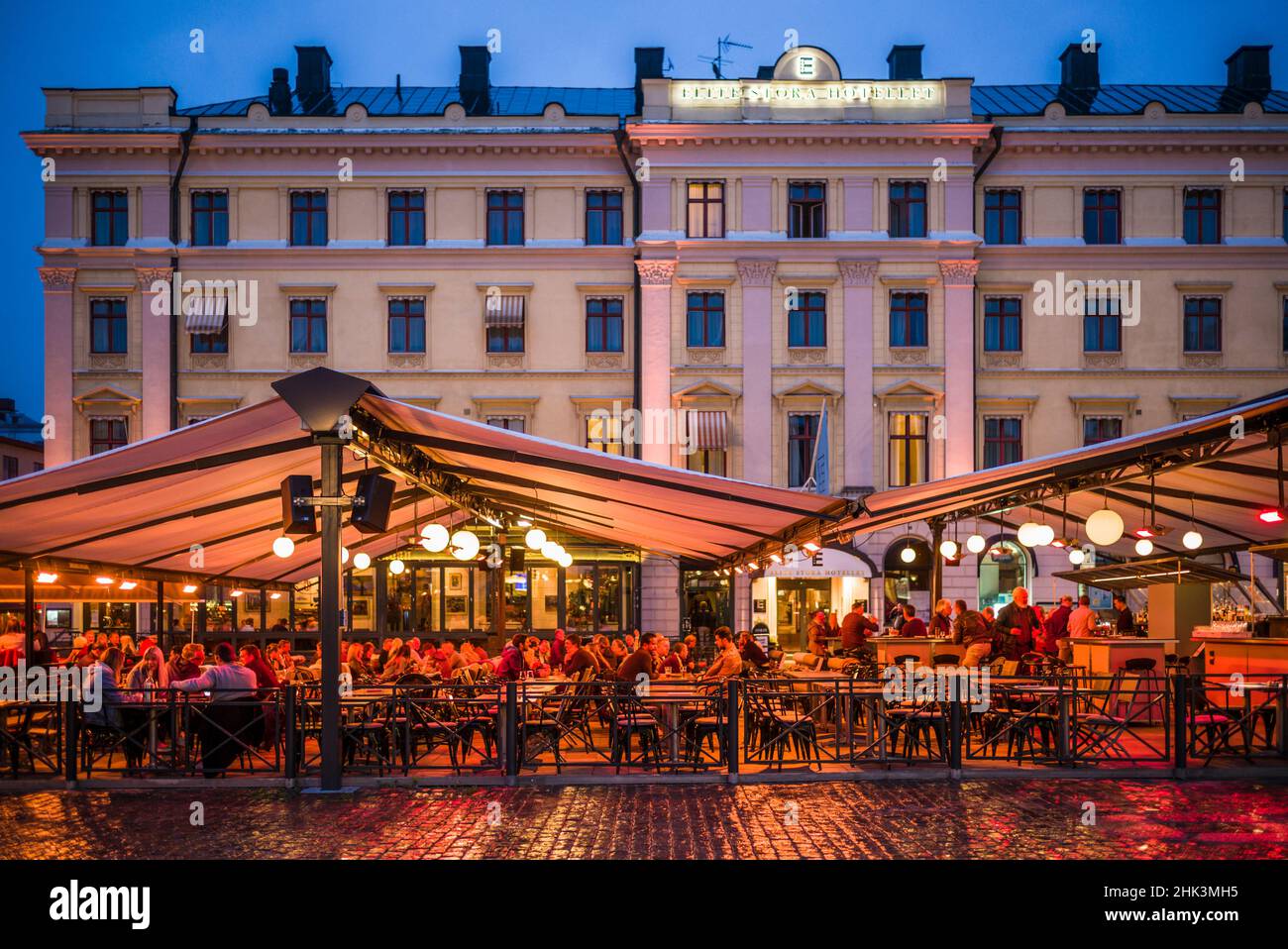 Sweden, Linkoping, cafes and bars on Stora target square, dusk Stock