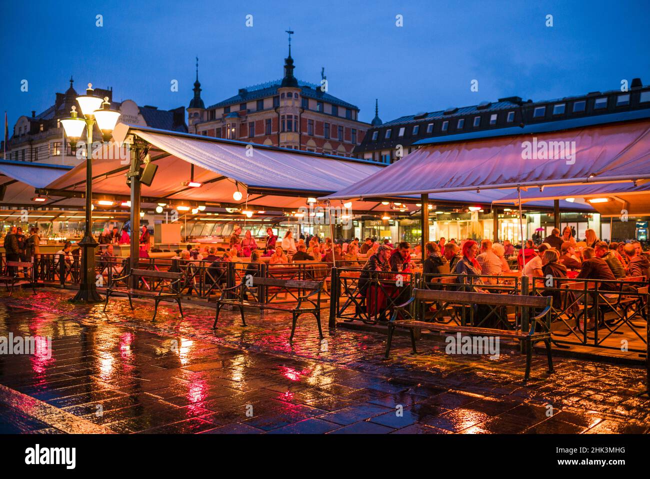 Sweden, Linkoping, cafes and bars on Stora target square, dusk Stock