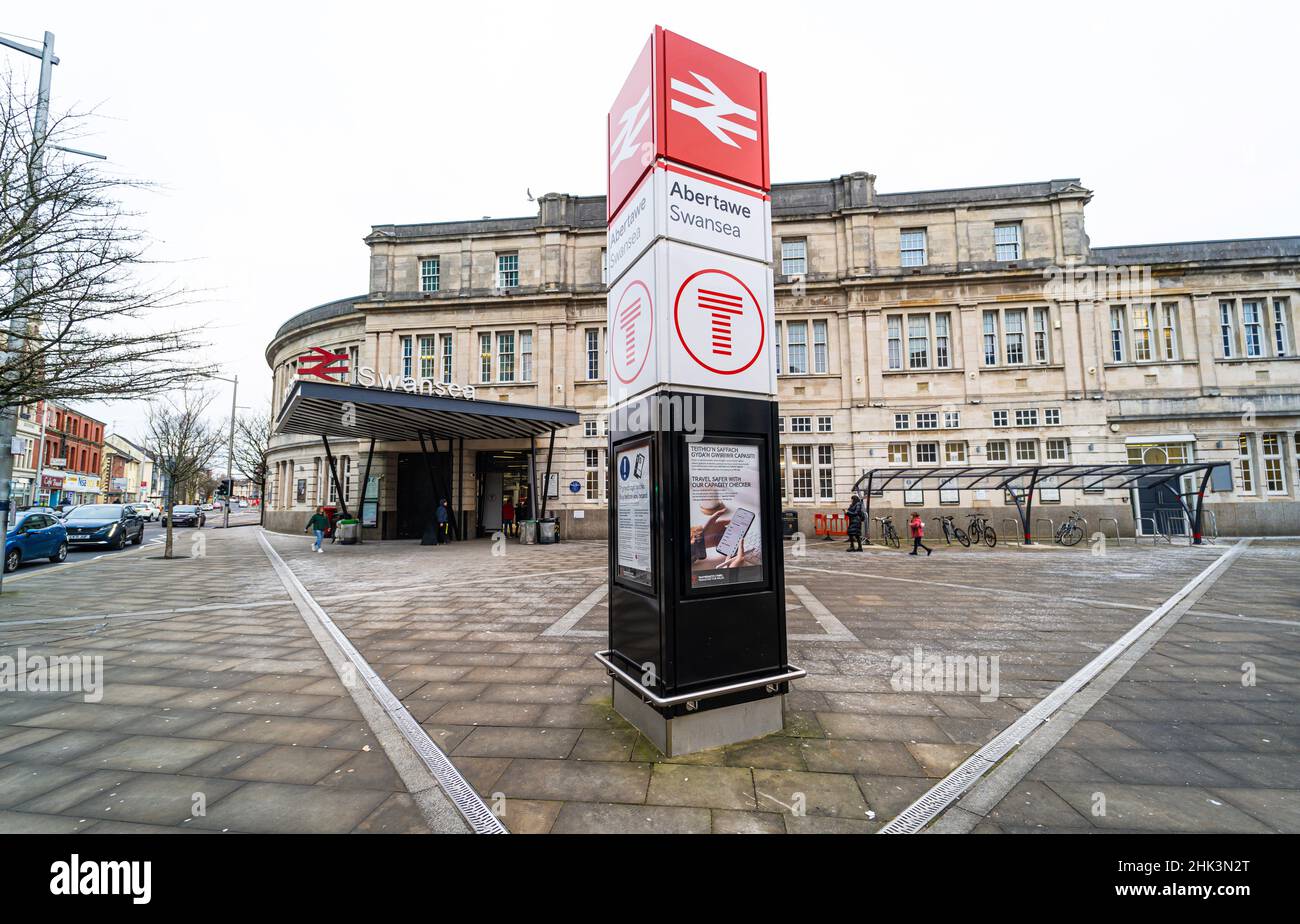 Swansea railway station building. Entrance sign of the train station. Wales, the United Kingdom - January 16, 2022 Stock Photo