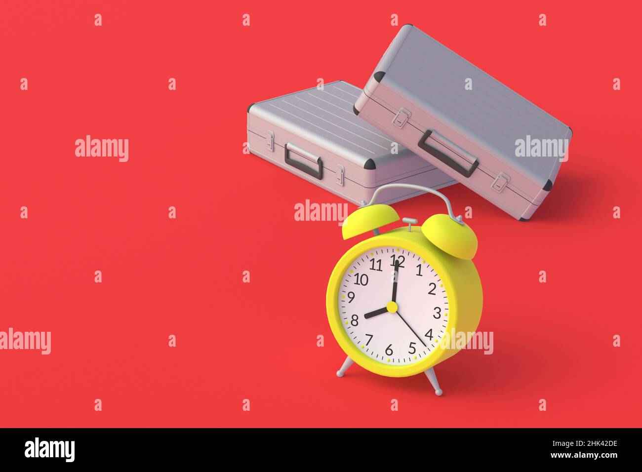 Metal suitcase near vintage alarm clock. Work schedule in the office