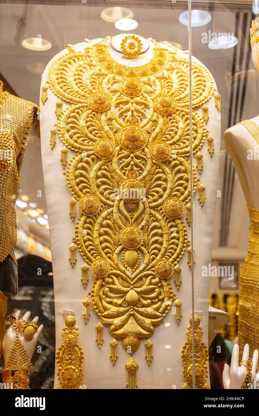 Massive golden ornamental necklace displayed in Dubai Gold Souk, Dubai, United Arab Emirates. Stock Photo
