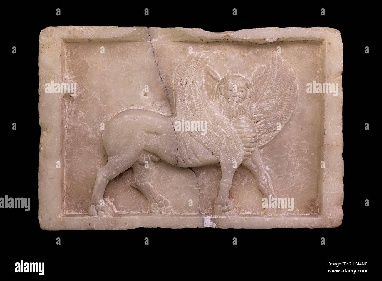 Winged bull with a bearded male head, alabaster relief on a stele. Pre-Islamic Civilisation, 1st century. Istanbul Archaeology Museum. Stock Photo