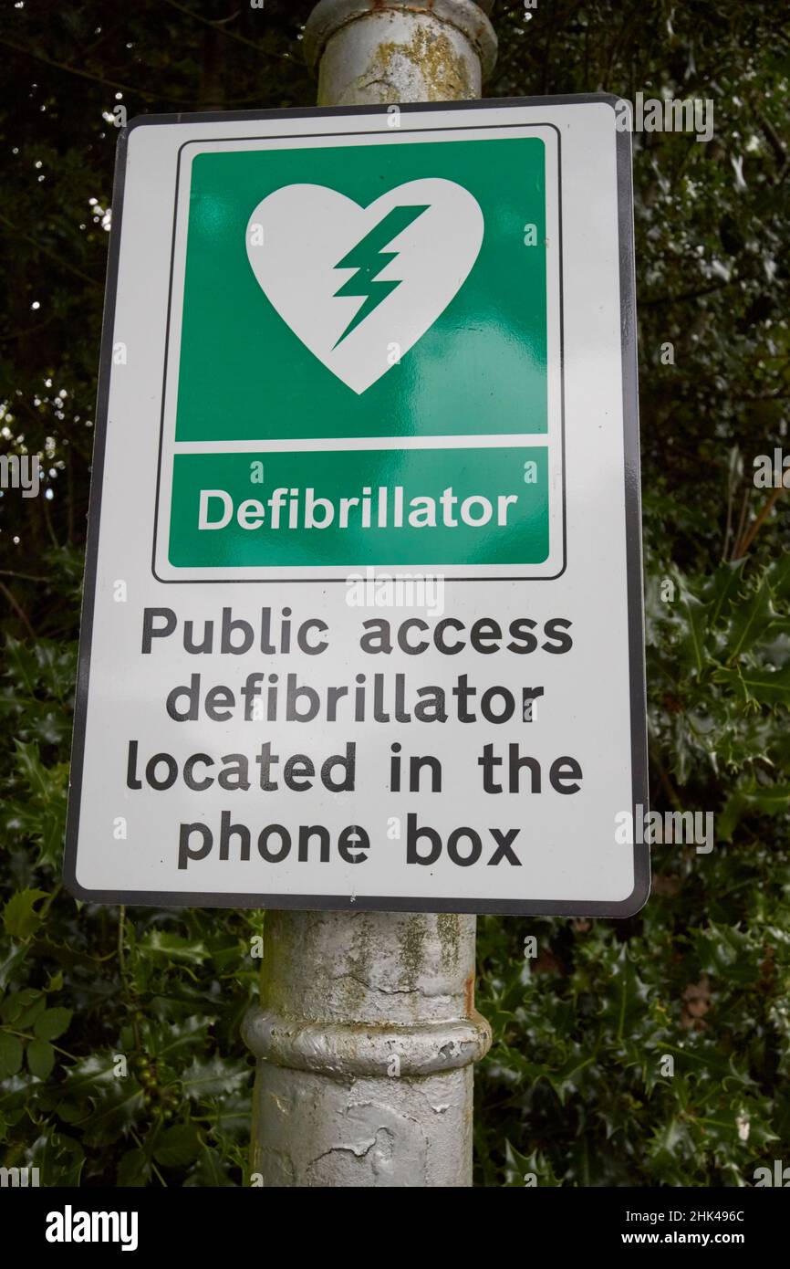 sign for defibrillator in old bt phone box near sawrey lake district