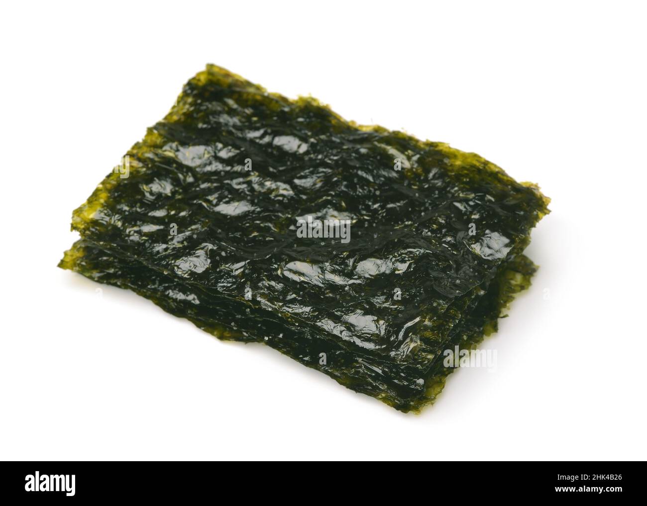 Nori Seaweed – Alga Nori Edible seaweed of the red algae. Binomial name:  Porphyra Umbilicalis. It is used in dried sheets to wrap the sushi. Stock  Photo