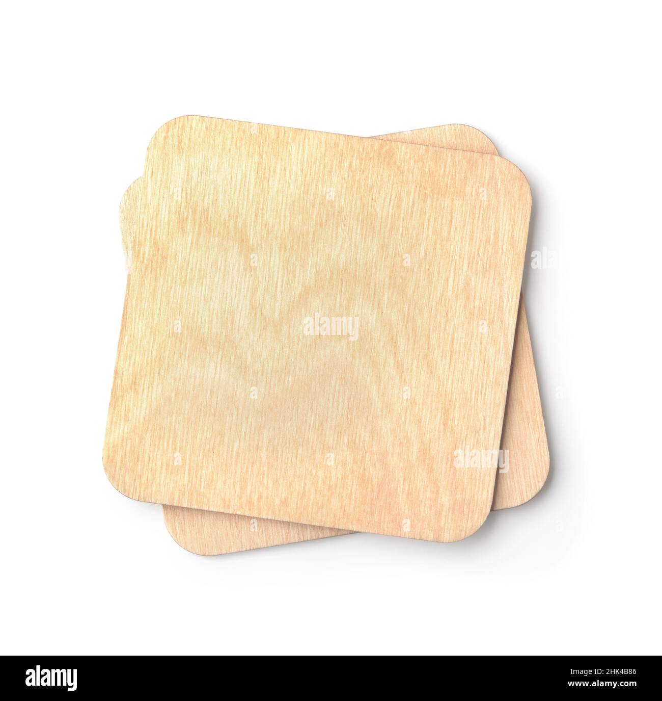 Top view of two blank square wooden beer coasters isolated on white Stock Photo