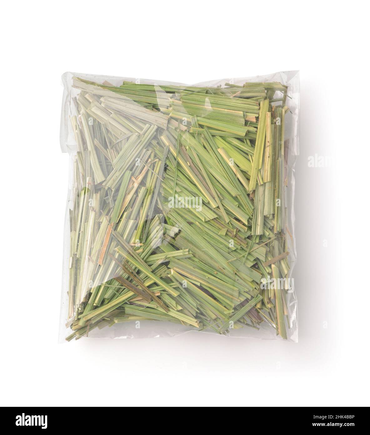 Top view of organic dry lemongrass in plastic bag isolated on white Stock Photo