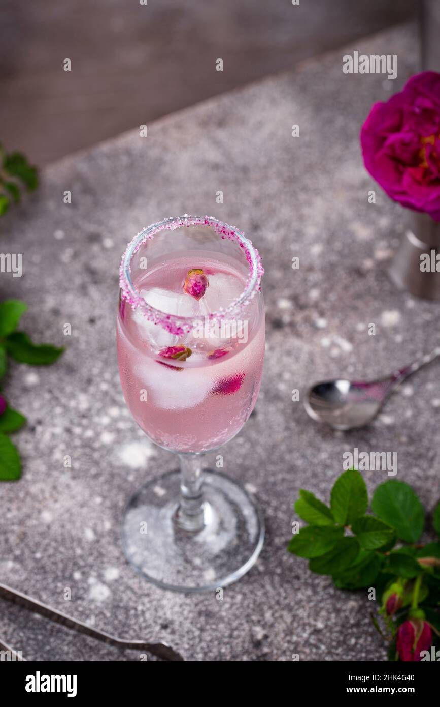 Pink cocktail with champagne and rose syrup Stock Photo - Alamy