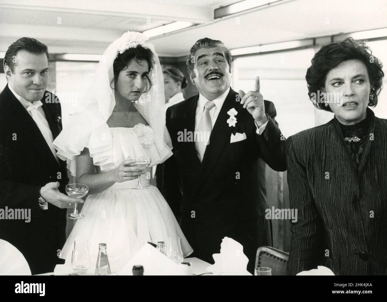 Actors Jan Gregor Kremp, Marita Ragonese, Mario Adorf, and Ilaria Occhini in the movie Pizza Colonia, 1991 Stock Photo