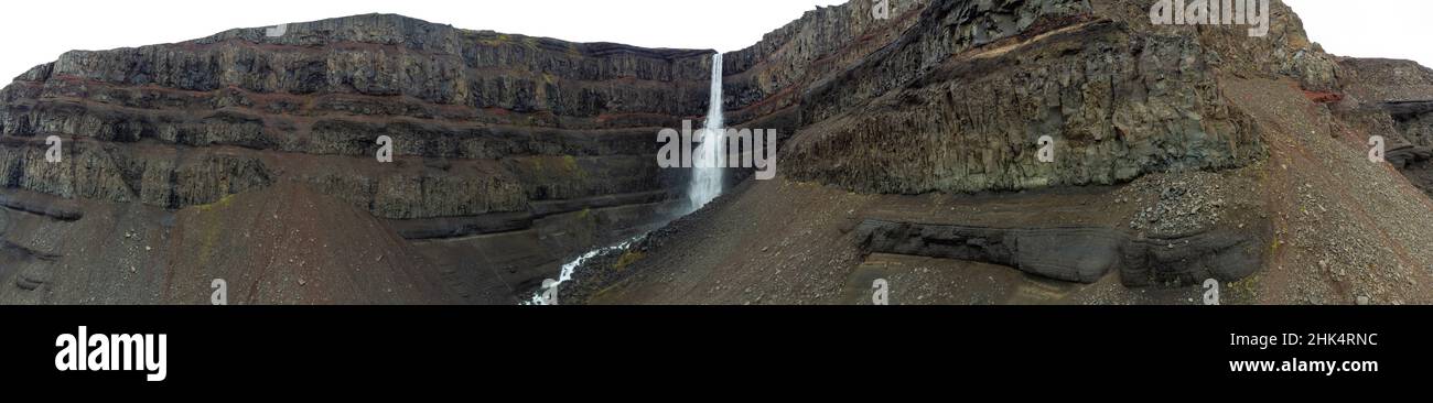 Famous Svartifoss waterfall wide panorama under cloudy sky Stock Photo